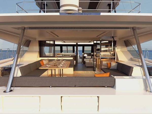 Slide: The Image of Luxurious 2024 Fountaine Pajot Samana 59 yacht with spacious outdoor seating and dining area. - 5