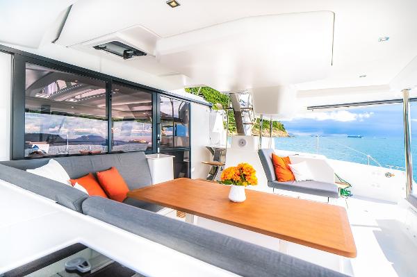 Slide: The Image of Luxurious 2024 Fountaine Pajot Tanna 47 yacht interior with ocean view. - 0