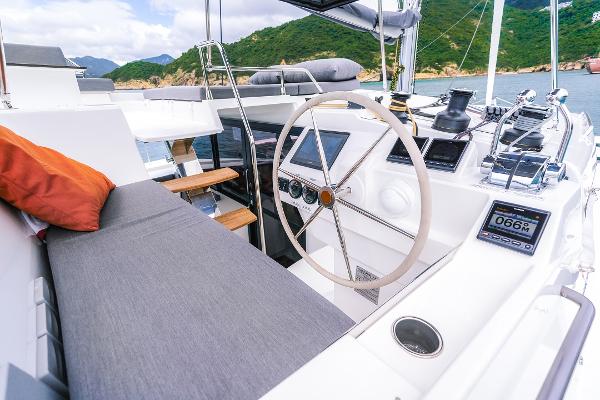 Slide: The Image of Helm station of 2024 Fountaine Pajot Tanna 47 catamaran with modern navigation equipment. - 12