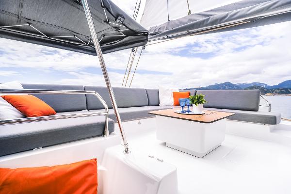 Slide: The Image of Luxurious deck seating on the 2024 Fountaine Pajot Tanna 47 catamaran. - 13