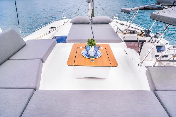 Slide: The Image of 2024 Fountaine Pajot Tanna 47 yacht deck with seating and table. - 14