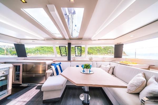 Slide: The Image of Luxurious interior of 2024 Fountaine Pajot Tanna 47 catamaran with panoramic windows and modern furnishings. - 17