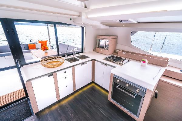 Slide: The Image of Modern kitchen interior of 2024 Fountaine Pajot Tanna 47 catamaran with ocean view. - 19