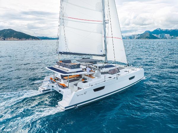 Slide: The Image of 2024 Fountaine Pajot Tanna 47 catamaran sailing on open water. - 3