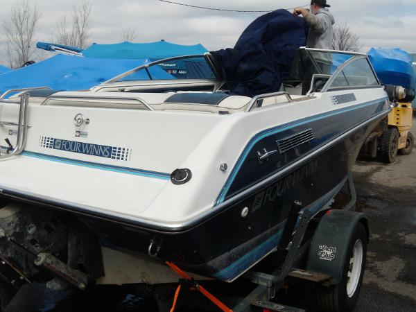 Slide: The Image of 1985 Four Winns 180 Horizon boat on trailer, covered and ready for transport. - 8