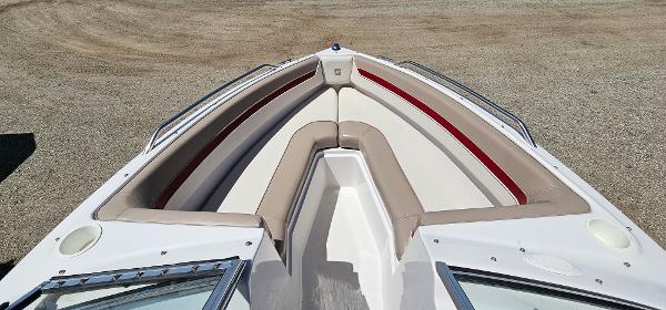 Slide: The Image of 1996 Four Winns 190 Horizon DLX bow seating area with beige and red upholstery. - 15