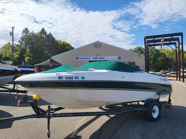 Slide: The Image of 1998 Four Winns 200 Horizon boat on trailer at dealership. - 3