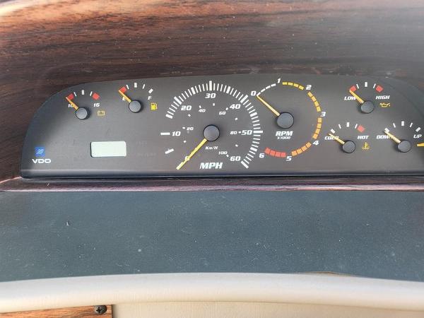 Slide: The Image of Dashboard of a 1998 Four Winns 200 Horizon boat, showing speedometer and gauges. - 7