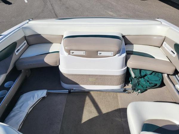 Slide: The Image of 1998 Four Winns 200 Horizon boat interior with beige and white seating. - 8