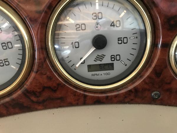 Slide: The Image of Close-up of a 2004 Four Winns 234 Funship tachometer displaying RPM. - 12