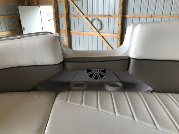 Slide: The Image of Interior seating of 2004 Four Winns 234 Funship boat with cup holders and speaker. - 26