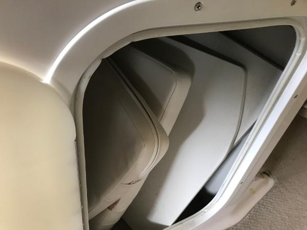 Slide: The Image of Storage compartment in 2004 Four Winns 234 Funship boat, featuring white interior. - 35