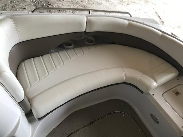Slide: The Image of 2004 Four Winns 234 Funship boat interior seating with cup holders. - 36