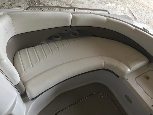 Slide: The Image of 2004 Four Winns 234 Funship boat interior with white cushioned seating. - 37