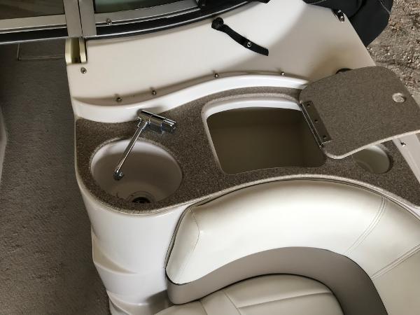 Slide: The Image of 2004 Four Winns 234 Funship boat interior with sink and storage compartment. - 40