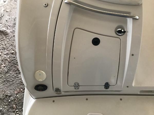 Slide: The Image of 2004 Four Winns 234 Funship boat interior detail with storage compartment and handle. - 41