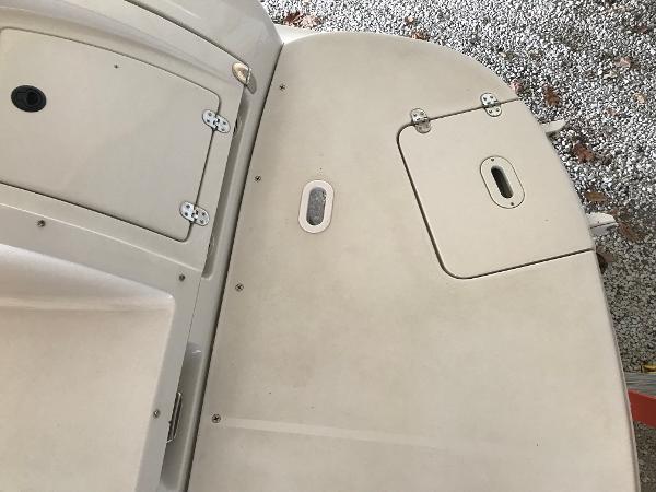 Slide: The Image of 2004 Four Winns 234 Funship boat deck with storage compartments. - 43
