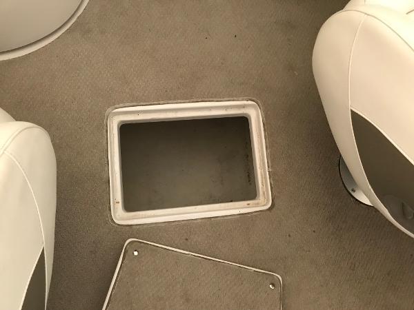 Slide: The Image of 2004 Four Winns 234 Funship boat interior storage compartment. - 46