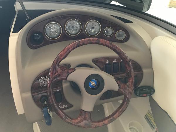 Slide: The Image of Steering wheel and dashboard of 2004 Four Winns 234 Funship boat. - 5