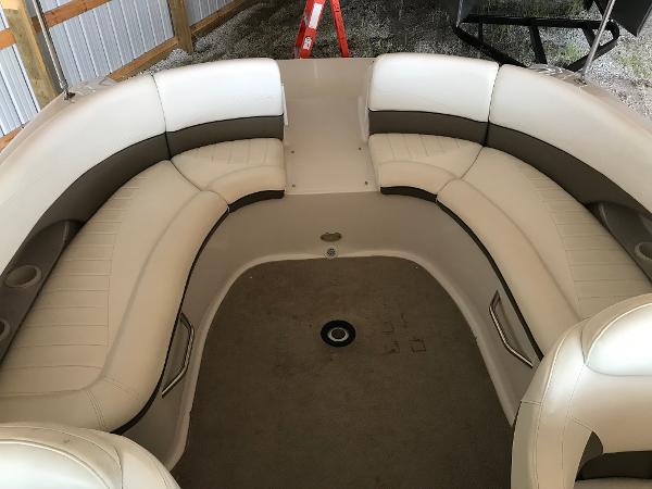 Slide: The Image of 2004 Four Winns 234 Funship boat interior with white and gray seating. - 6