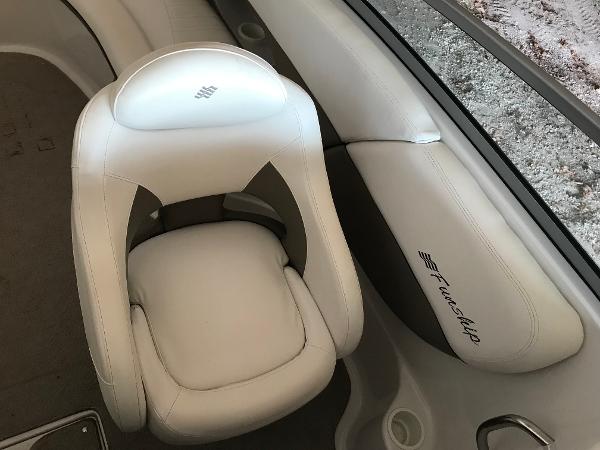Slide: The Image of 2004 Four Winns 234 Funship boat interior with white leather seating. - 8