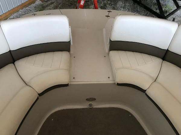 Slide: The Image of 2004 Four Winns 234 Funship boat interior with white and gray seating. - 9
