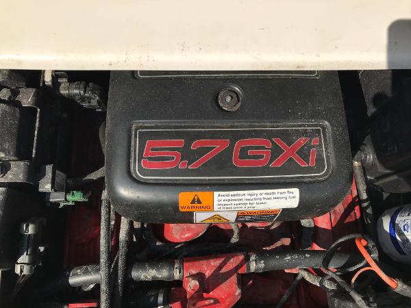 Slide: The Image of 2002 Four Winns 245 Sundowner engine, 5.7 GXI model, close-up view. - 10