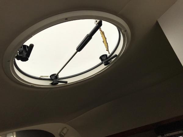 Slide: The Image of Circular hatch of a 2002 Four Winns 245 Sundowner boat. - 15