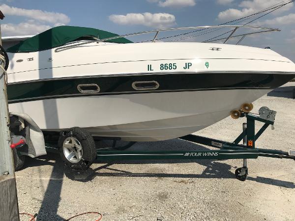 Slide: The Image of 2002 Four Winns 245 Sundowner boat on trailer, side view. - 2
