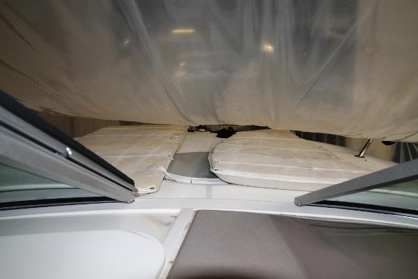 Slide: The Image of 2004 Four Winns 268 Vista boat interior with covered seating area. - 15