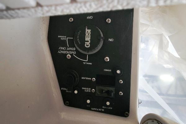 Slide: The Image of Control panel of a 2004 Four Winns 268 Vista boat, featuring emergency start switch. - 34