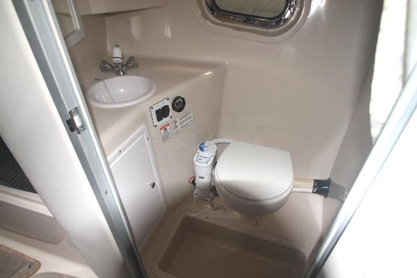 Slide: The Image of 2004 Four Winns 268 Vista boat bathroom with sink and toilet. - 35