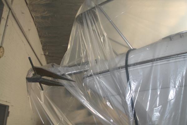 Slide: The Image of 2004 Four Winns 268 Vista boat covered in protective plastic in a storage facility. - 41