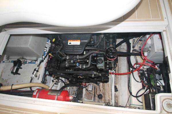 Slide: The Image of Engine compartment of a 2004 Four Winns 268 Vista boat, showing detailed mechanical components. - 43