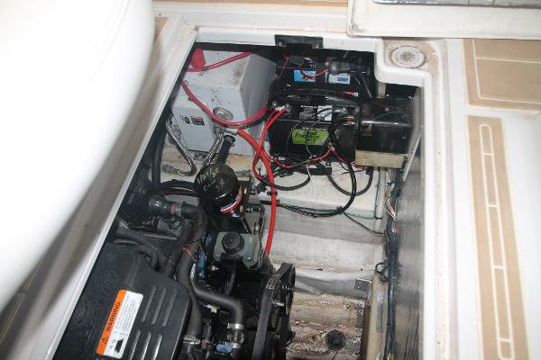 Slide: The Image of Engine compartment of 2004 Four Winns 268 Vista boat, showing wiring and components. - 44