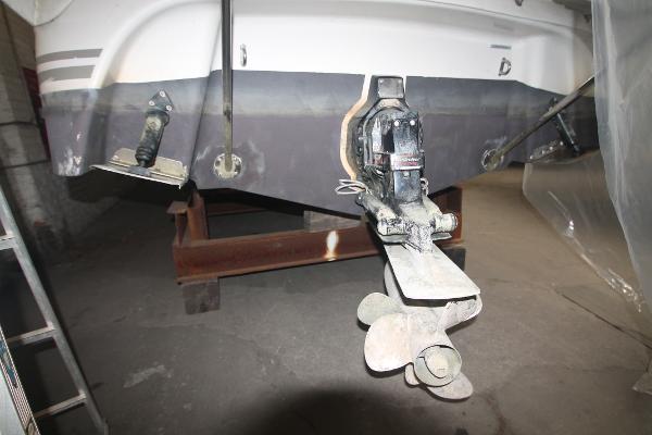 Slide: The Image of 2004 Four Winns 268 Vista boat stern with propeller and outdrive visible. - 47