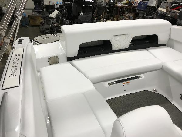 Slide: The Image of 2023 Four Winns H1 OB boat interior with white seating and modern design. - 12