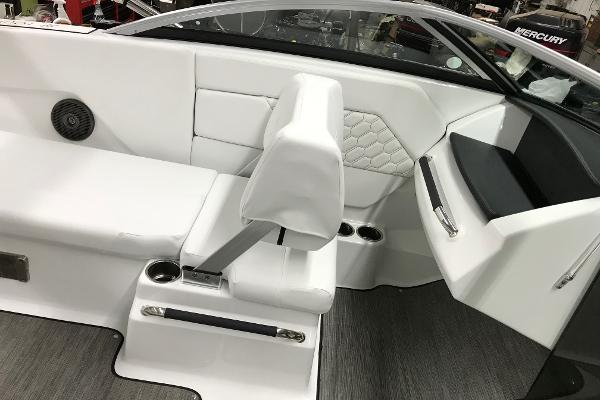 Slide: The Image of 2023 Four Winns H1 OB boat interior with white seating and cup holders. - 14