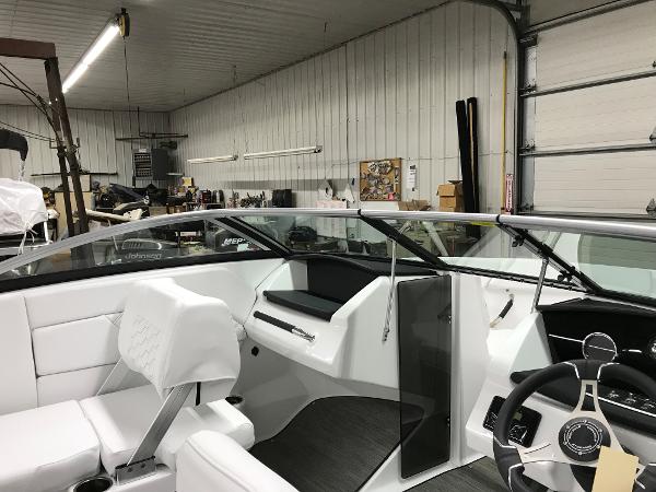 Slide: The Image of 2023 Four Winns H1 OB boat interior in a workshop. - 4