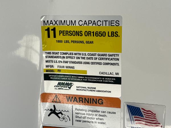 Slide: The Image of 2023 Four Winns H4 boat capacity label: 11 persons or 1650 lbs, USCG compliant. - 42