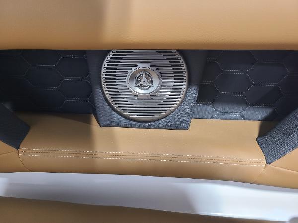Slide: The Image of 2024 Four Winns HD5 Surf boat interior speaker and upholstery detail. - 13