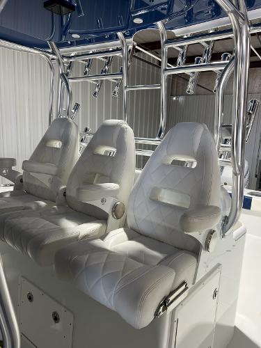 Slide: The Image of 2021 Freeman 42LR boat with luxurious white leather seats and chrome accents. - 5