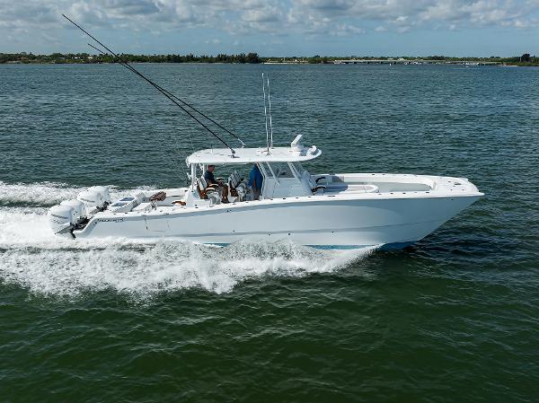 Slide: The Image of 2022 Freeman Center Console boat cruising on open water. - 0