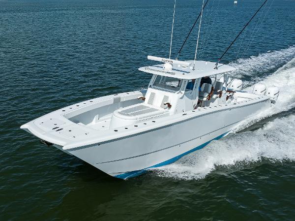Slide: The Image of 2022 Freeman Center Console boat cruising on open water. - 1