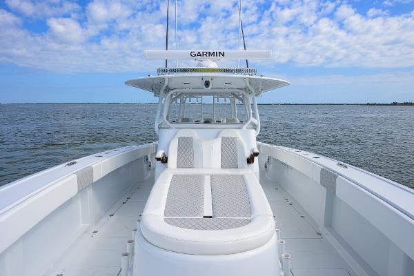 Slide: The Image of 2022 Freeman Center Console boat on open water under blue sky. - 11