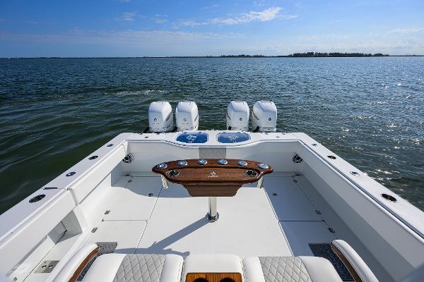 Slide: The Image of 2022 Freeman Center Console boat with quad engines on open water. - 13