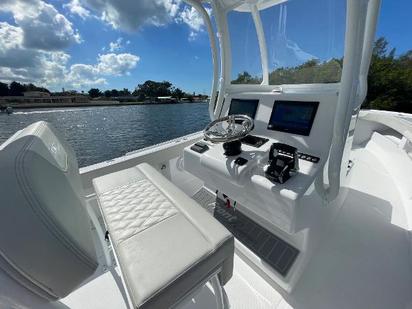 Slide: The Image of 2024 Front Runner 26 Center Console boat interior with helm and seating. - 11
