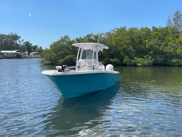 Slide: The Image of 2024 Front Runner 26 Center Console boat on calm water near mangroves. - 3
