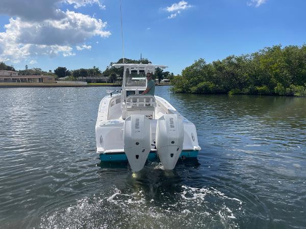 Slide: The Image of 2024 Front Runner 26 Center Console boat on water with twin engines. - 6