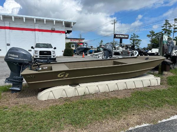 Slide: The Image of 2023 G3 1652 VBW boat with Yamaha outboard motor on display at dealership. - 0